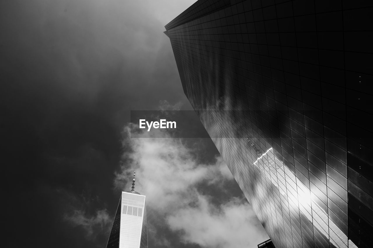 LOW ANGLE VIEW OF TELEPHONE BOOTH AGAINST SKY