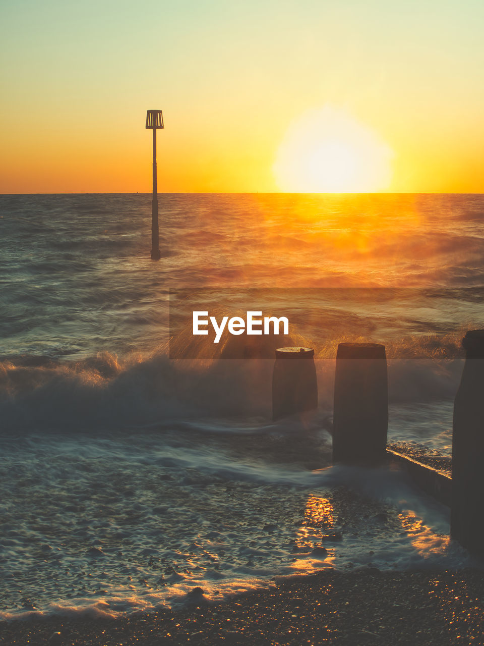 SCENIC VIEW OF BEACH DURING SUNSET