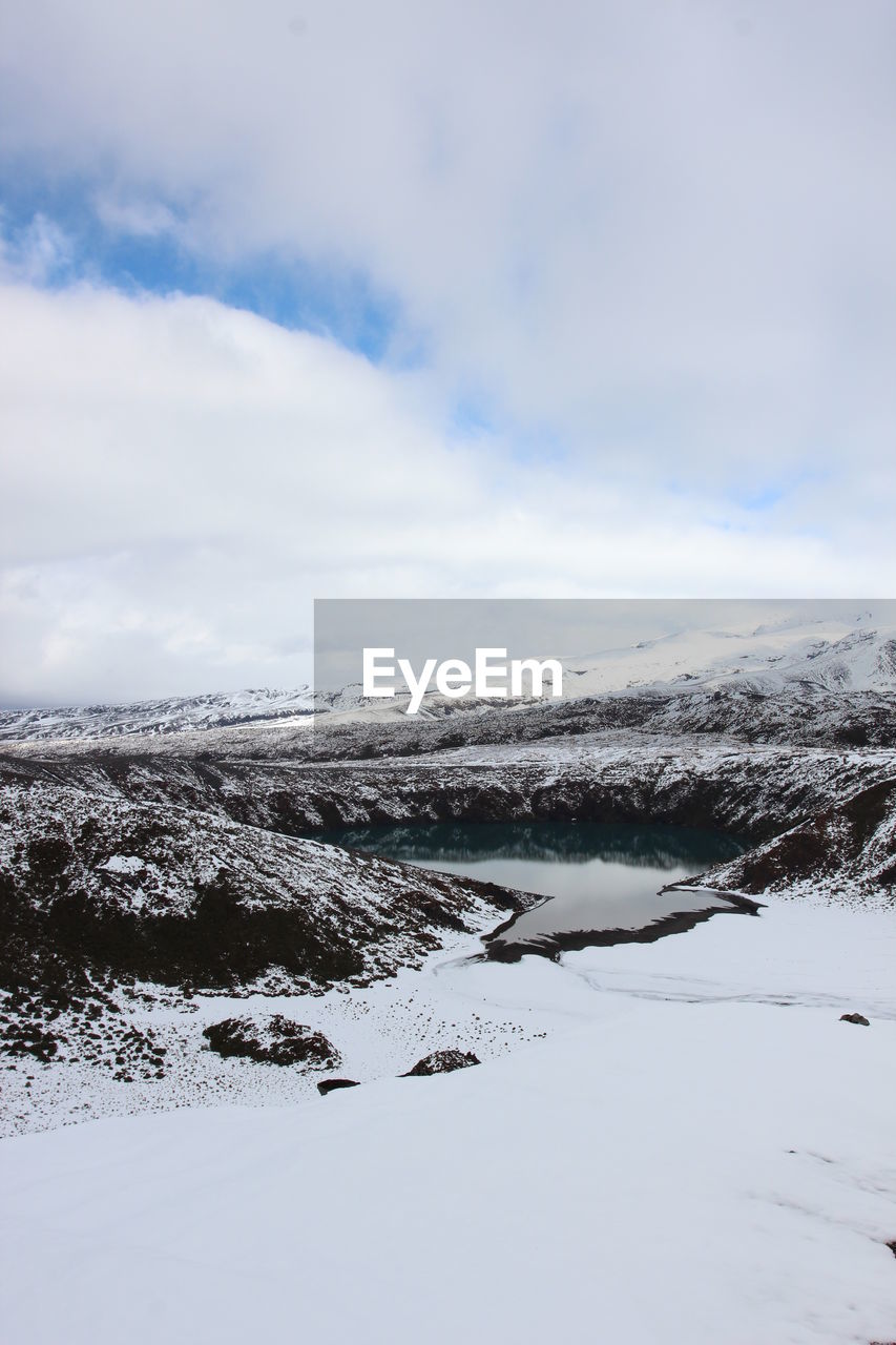 The lower tama lake in the white snow covered tongariro national park in new zealand. 