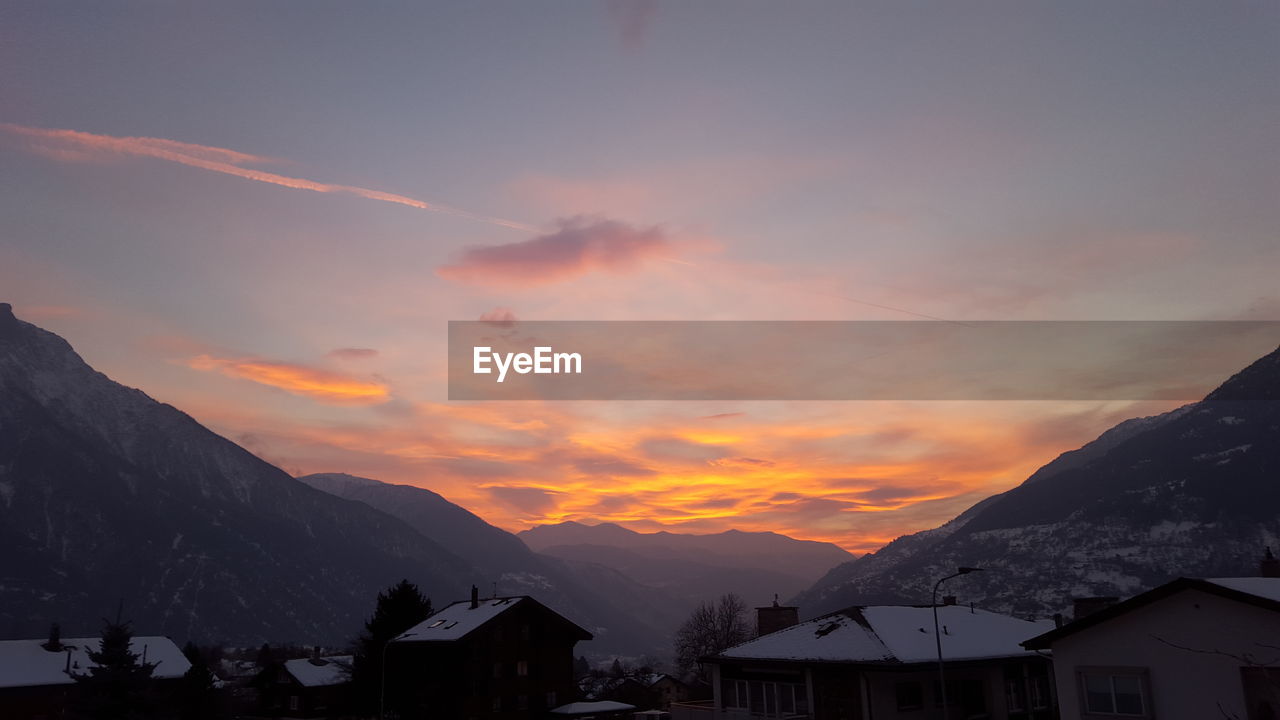 Scenic view of mountains against sky during sunset