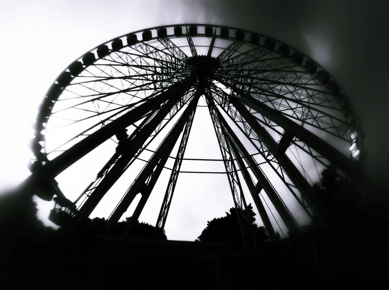 LOW ANGLE VIEW OF FERRIS WHEEL AGAINST THE SKY