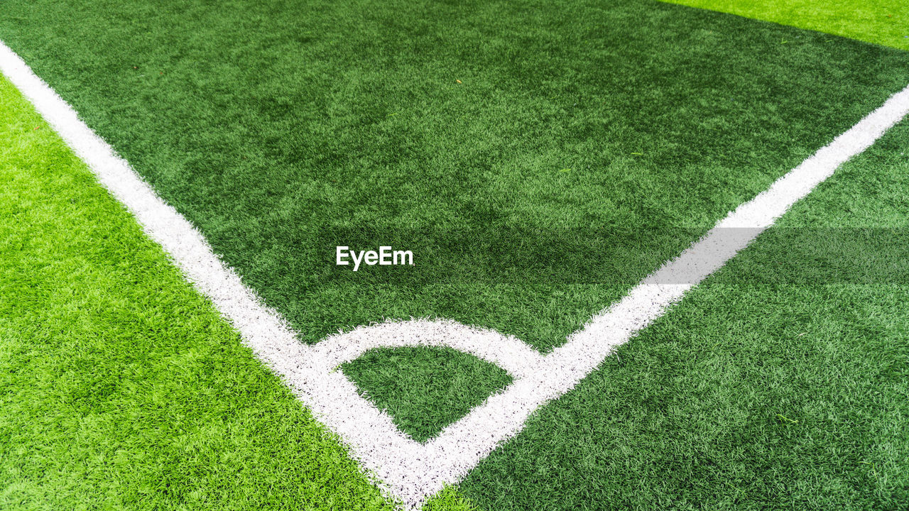 HIGH ANGLE VIEW OF SOCCER FIELD AGAINST GREEN BACKGROUND