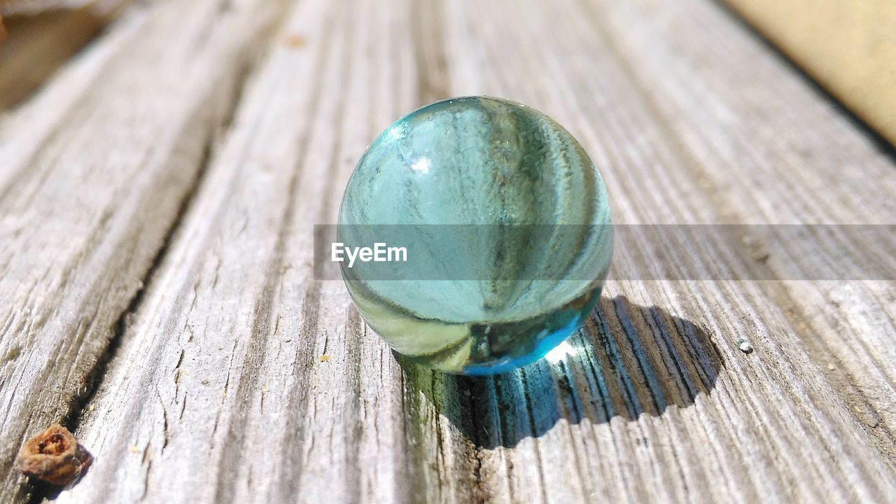 Crystal ball on wooden table