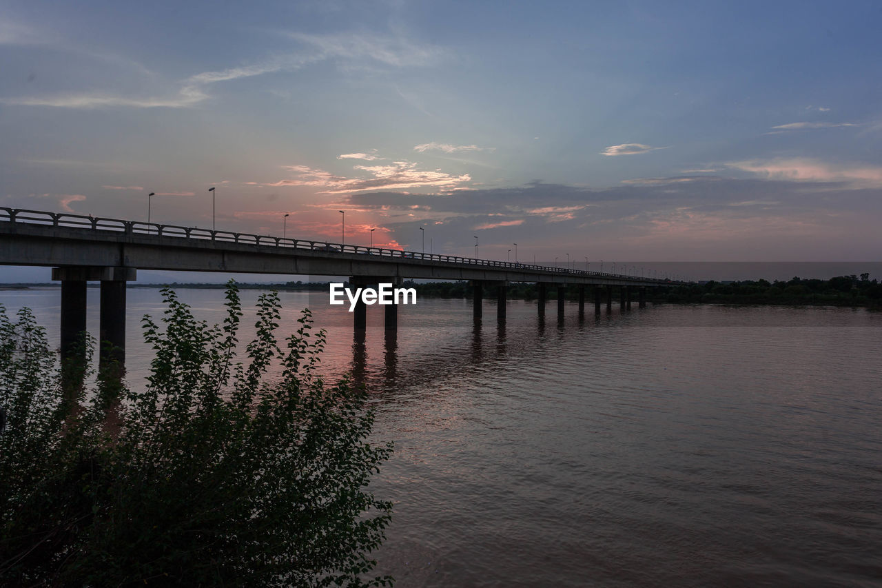 SCENIC VIEW OF BRIDGE OVER RIVER AGAINST SKY