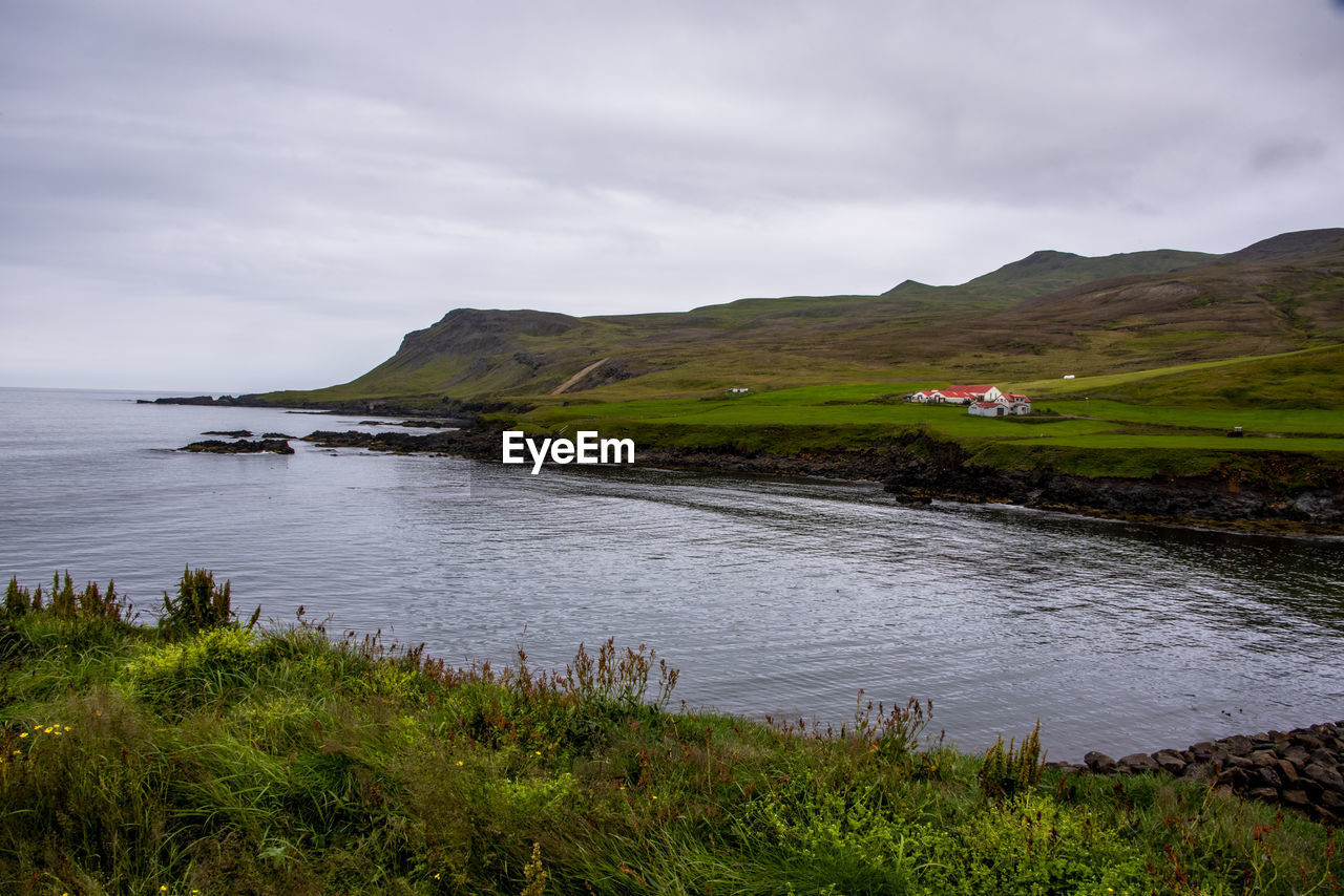 Icelandic fjord between ocean covered mountains at borgarfjordur eystri in eastern iceland