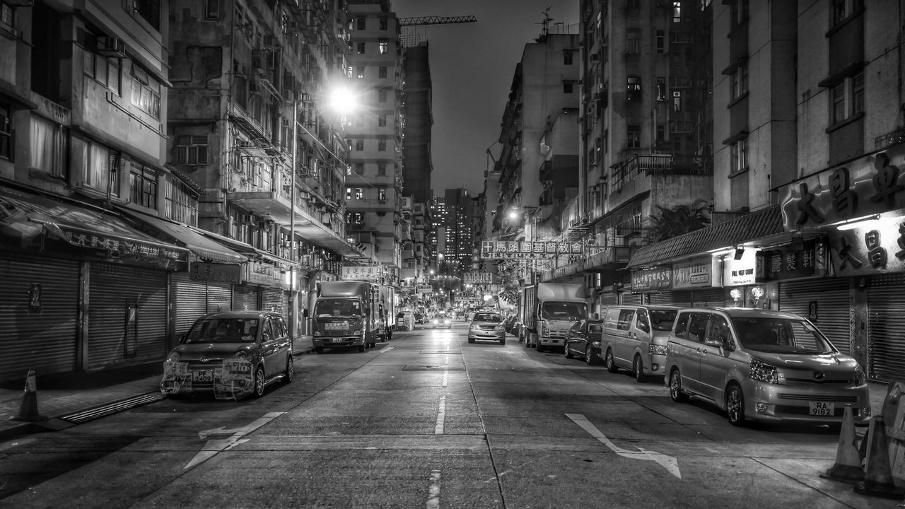 ILLUMINATED CITY STREET AT NIGHT