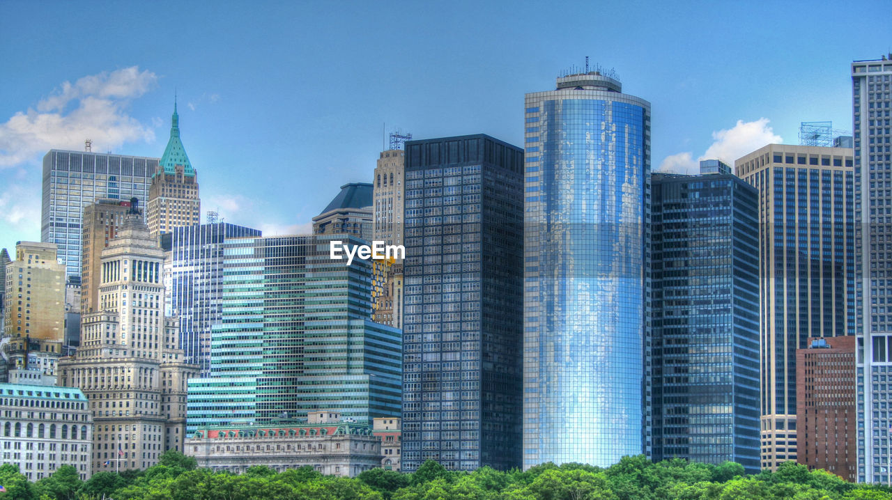 VIEW OF SKYSCRAPERS AGAINST BLUE SKY