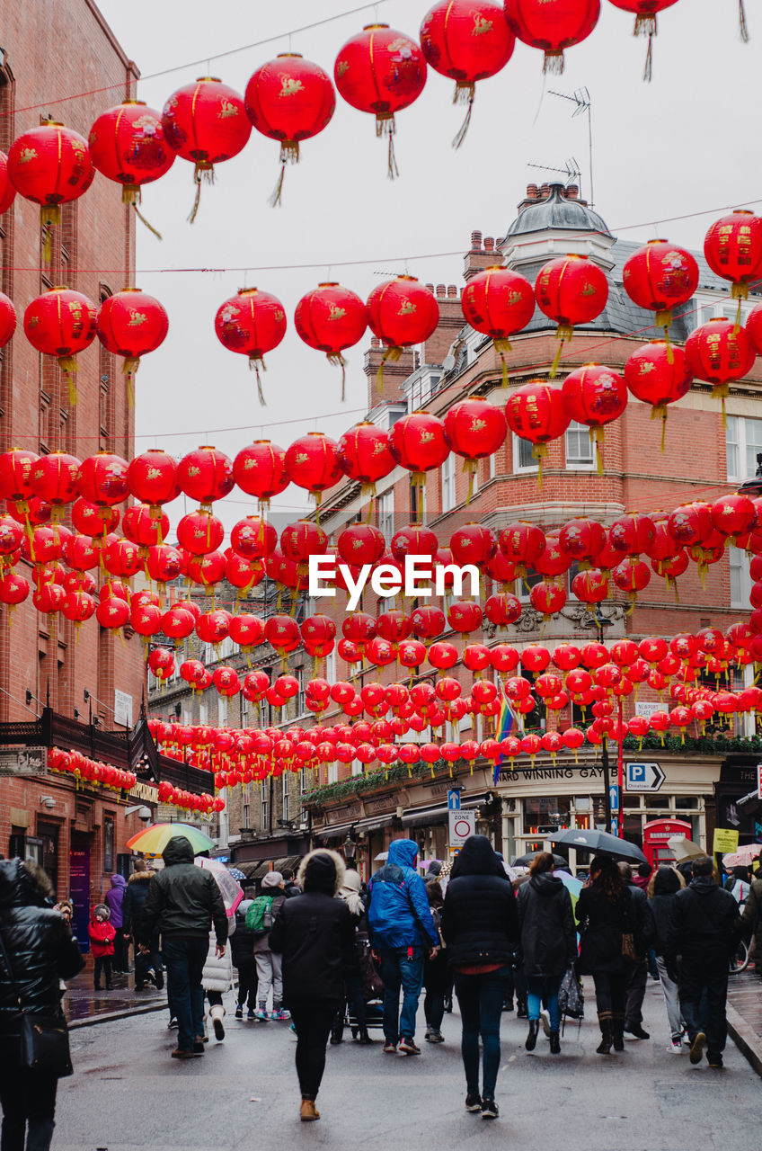 GROUP OF PEOPLE IN RED LANTERNS