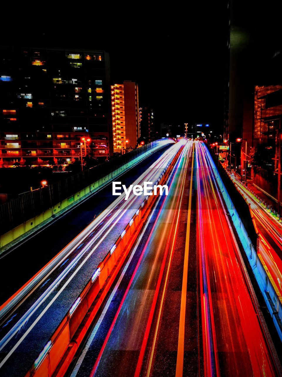 High angle view of light trails on road at night