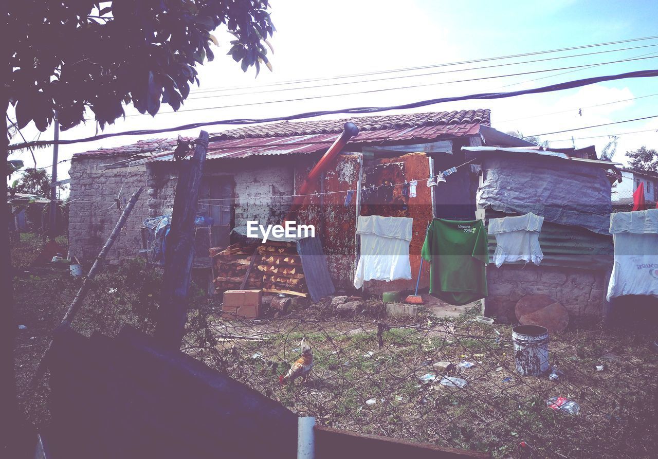 CLOTHES DRYING AGAINST HOUSE