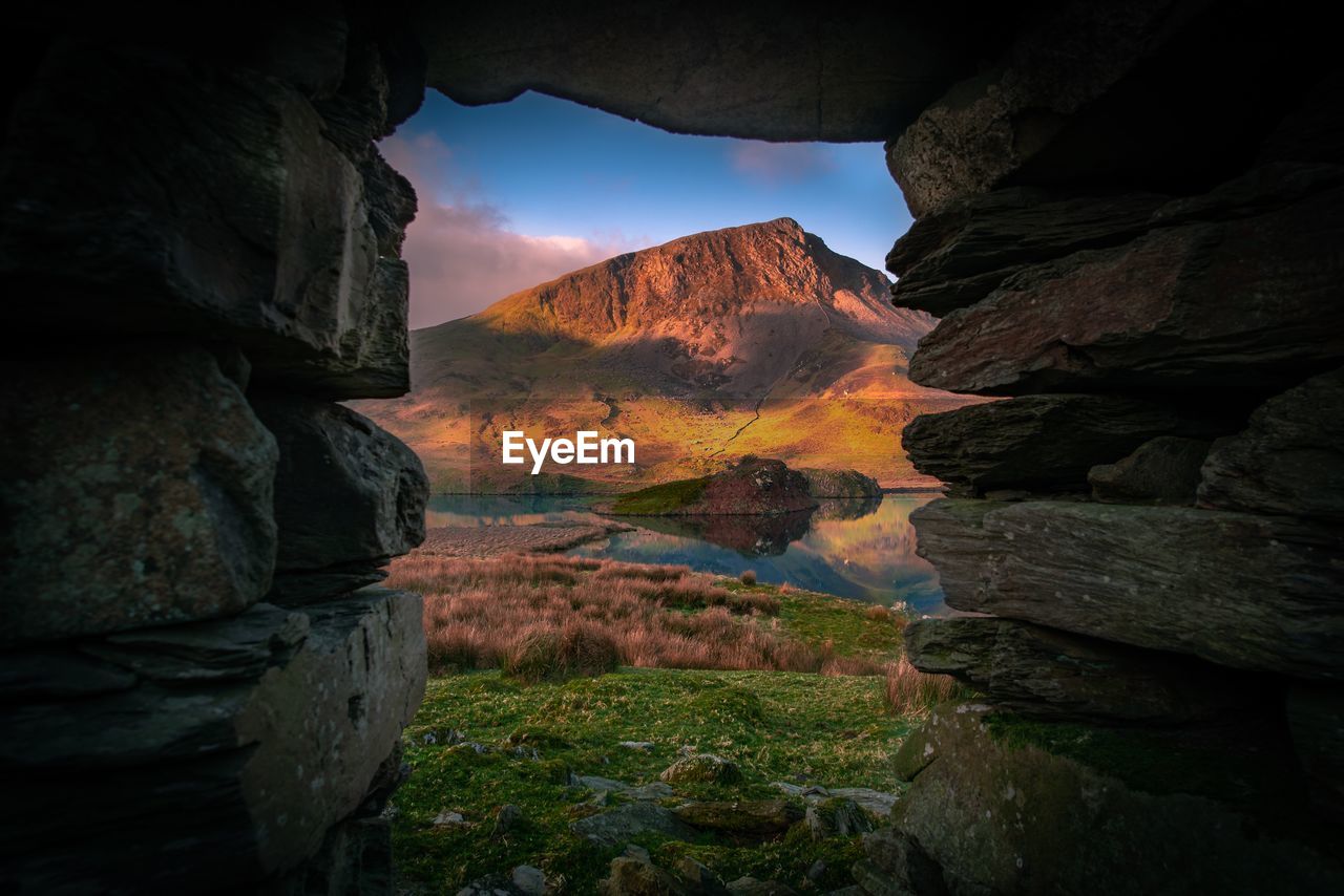 Rock formation on land against sky