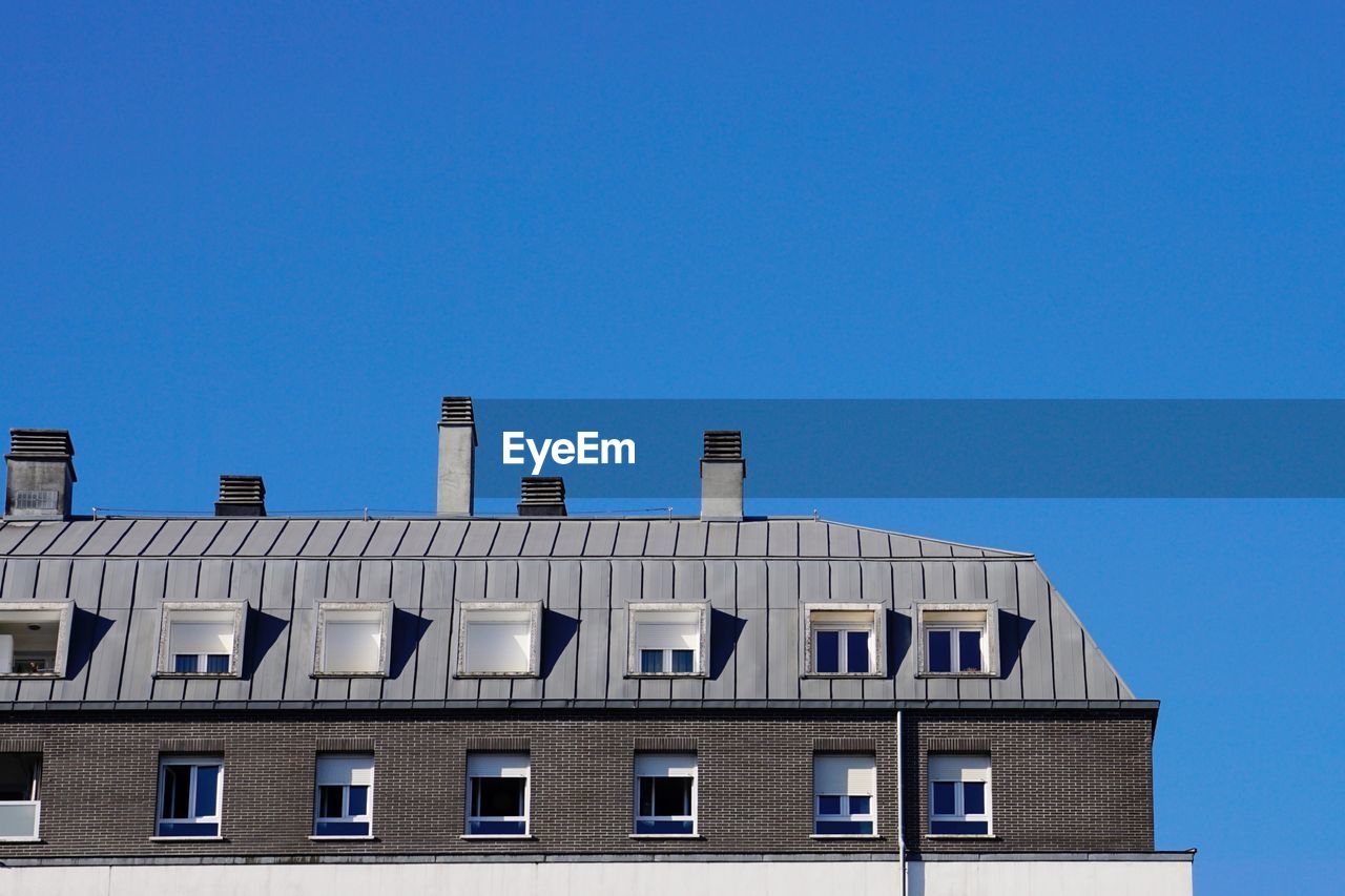 Chimney on the rooftop of the house, architecture in bilbao city, spain