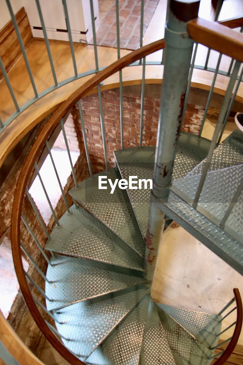 staircase, spiral staircase, spiral, stairs, steps and staircases, architecture, railing, indoors, wood, built structure, high angle view, iron, no people, metal, pattern