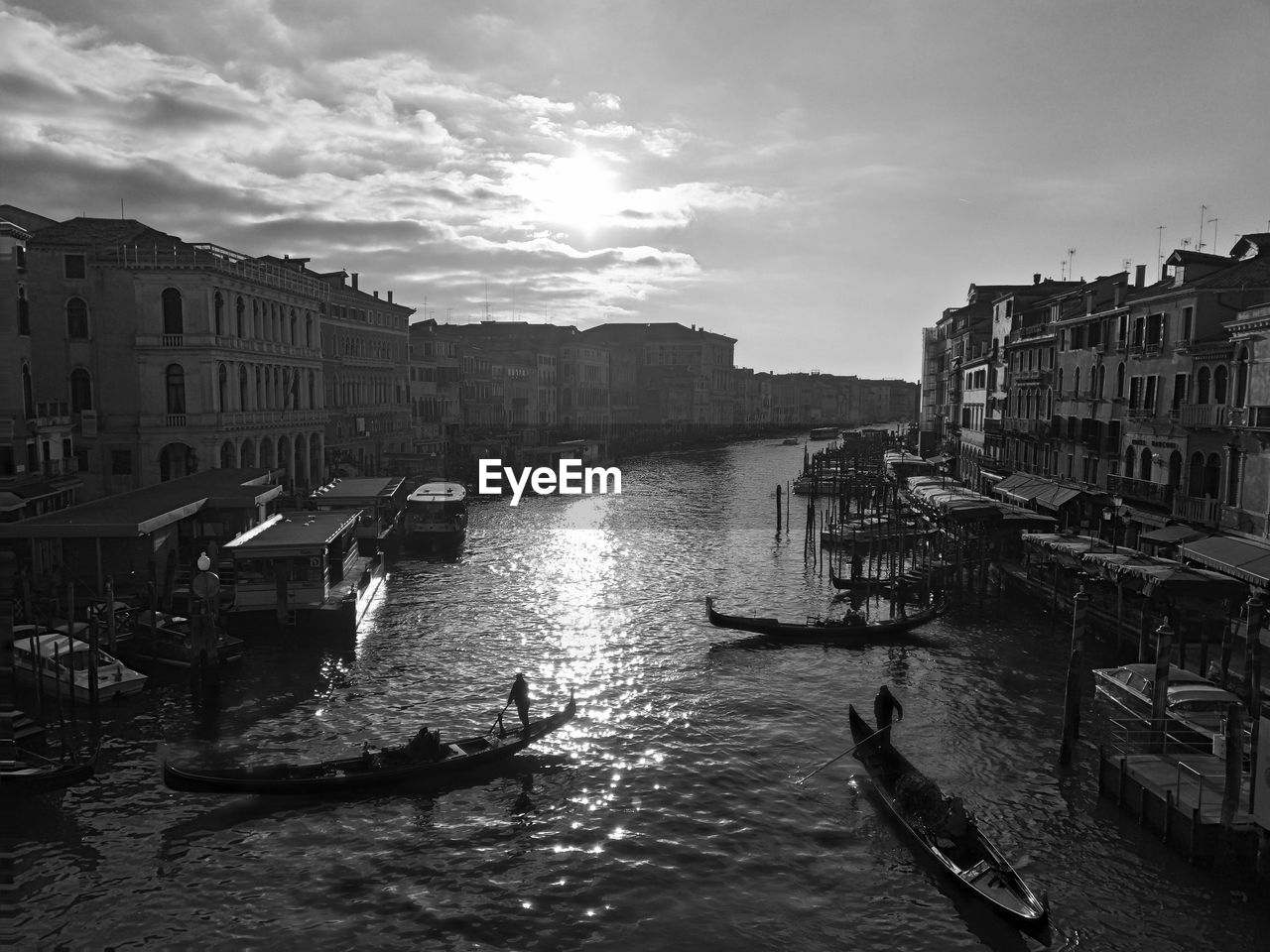 BOATS IN CANAL ALONG BUILDINGS