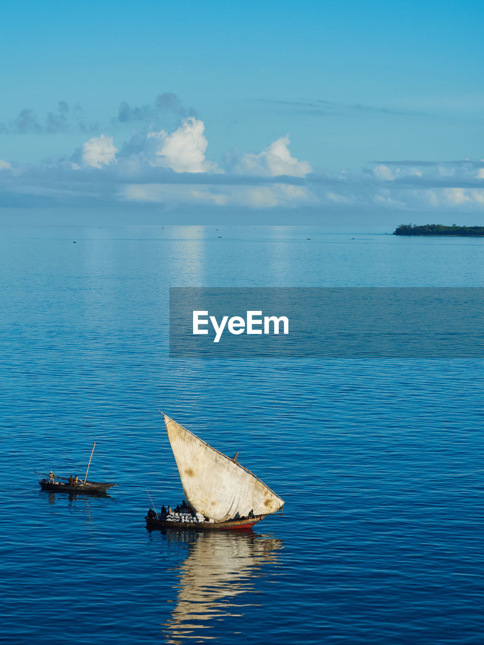 Traditional african sailing boat in open sea during the day.