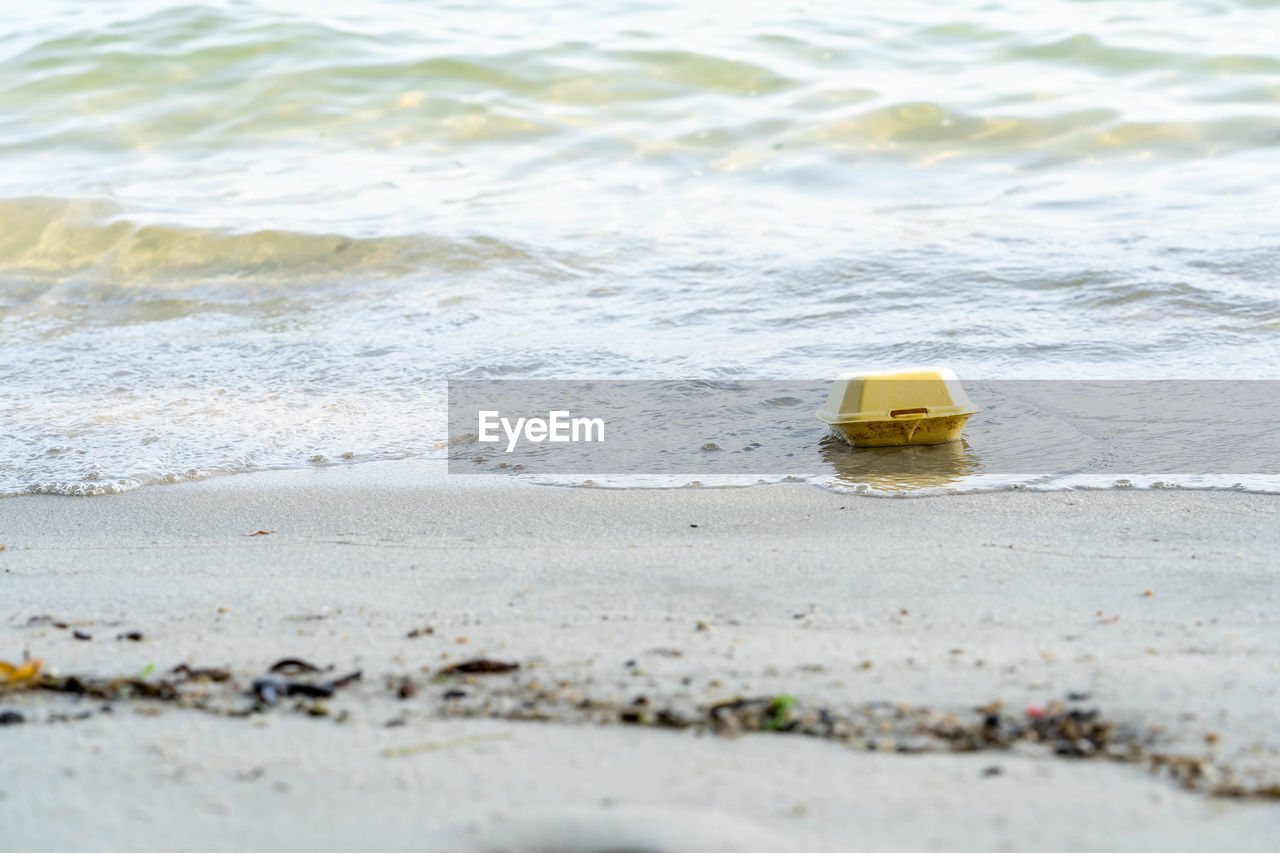 TOY BOAT ON BEACH