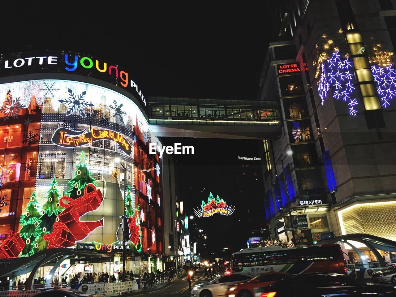 VIEW OF CITY STREET AT NIGHT