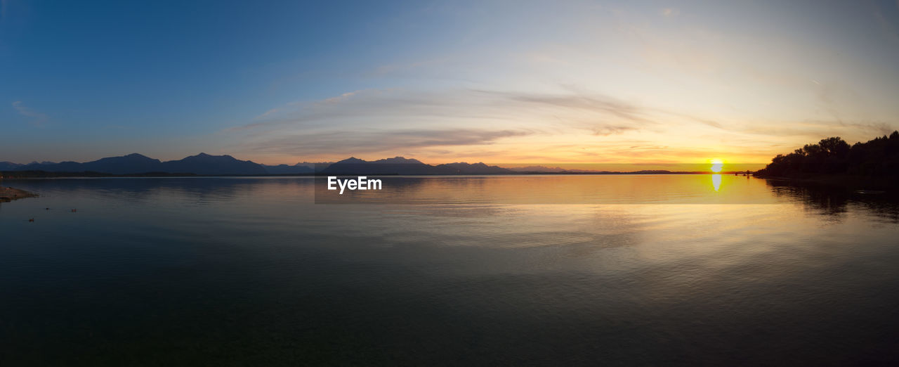 Scenic view of lake against sky during sunset