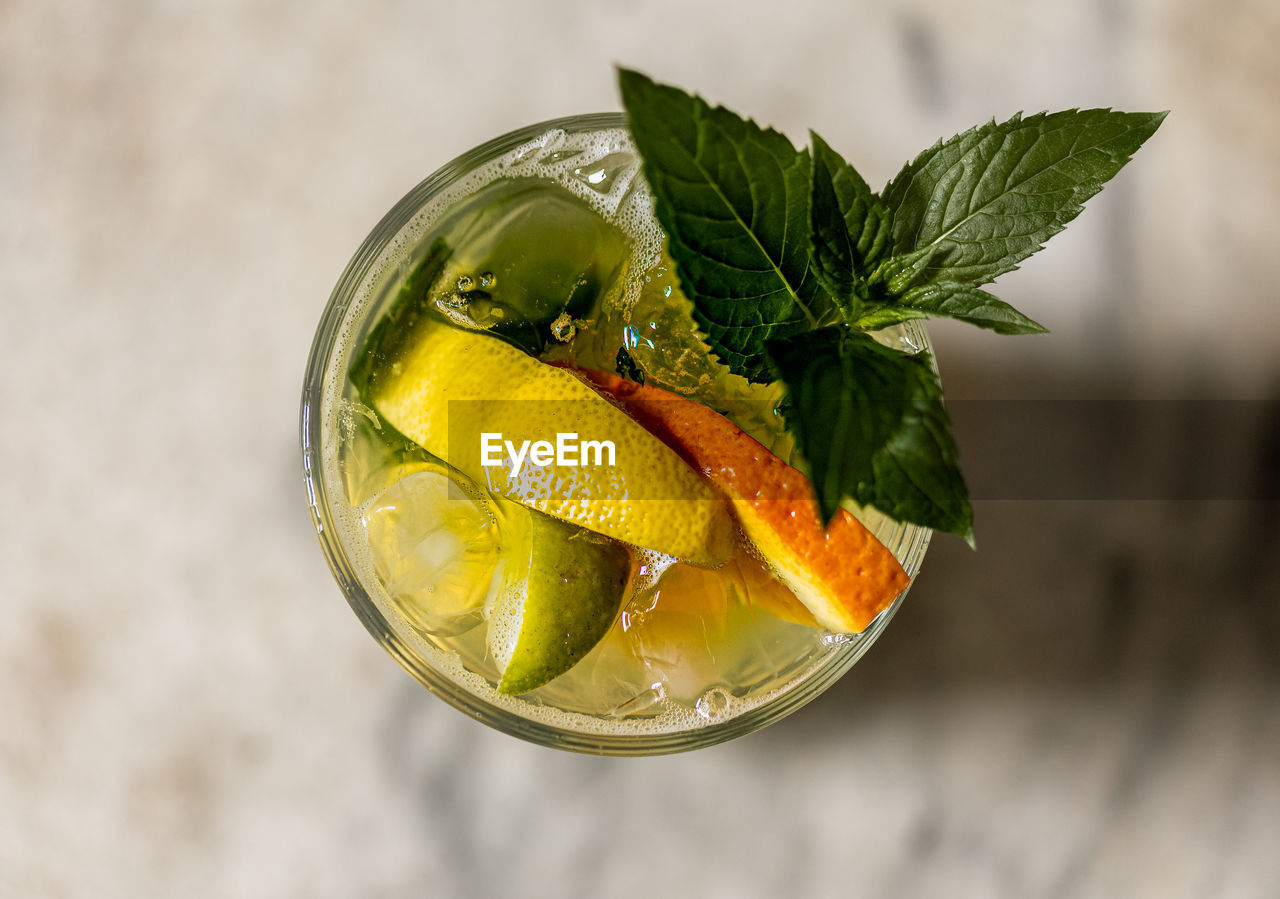 CLOSE-UP OF LEMON ON TABLE