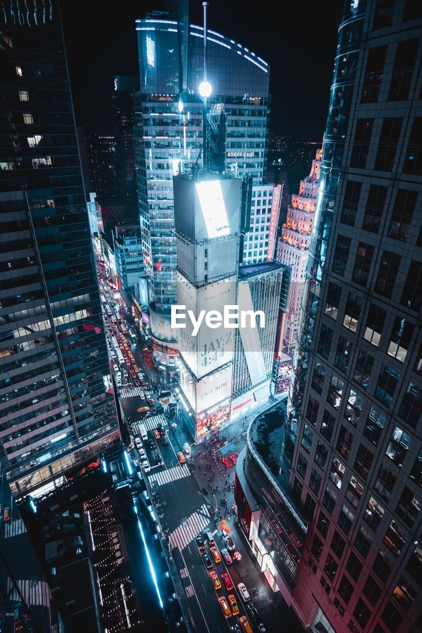 Illuminated buildings in city at night