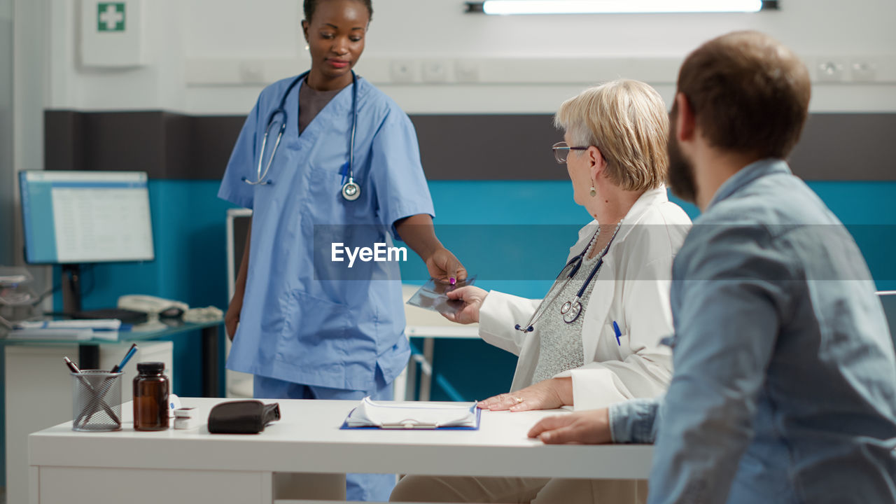 Doctor examining patient in hospital