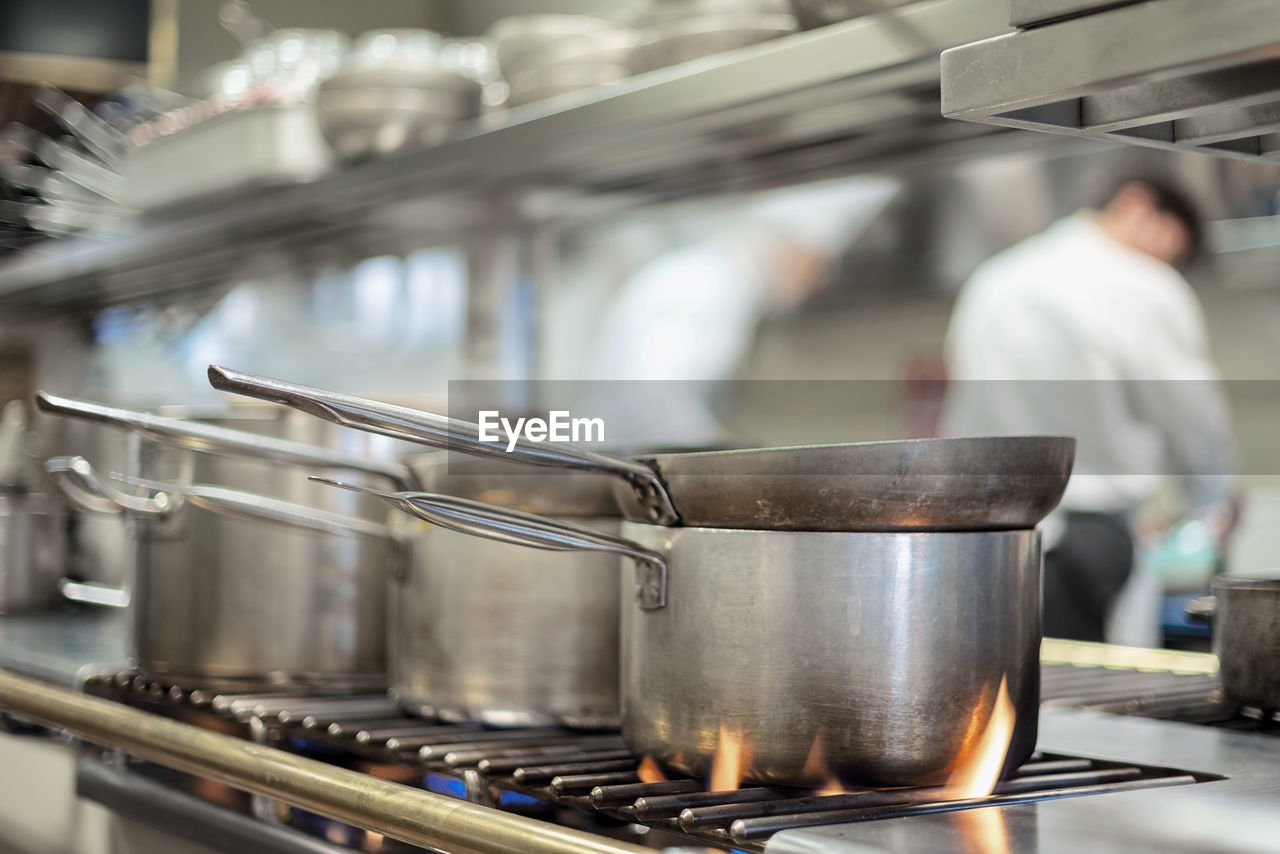 Food being prepared on stove in commercial kitchen