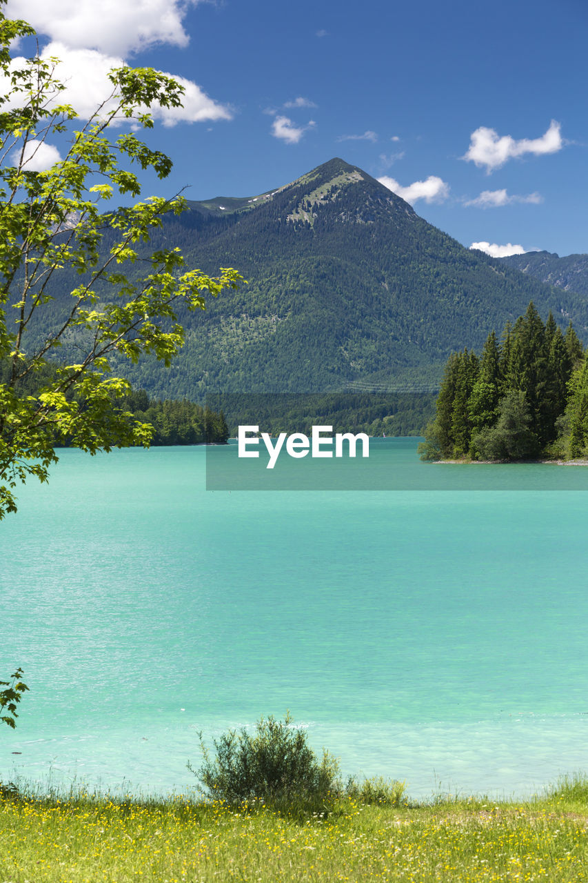 Scenic view of lake against blue sky