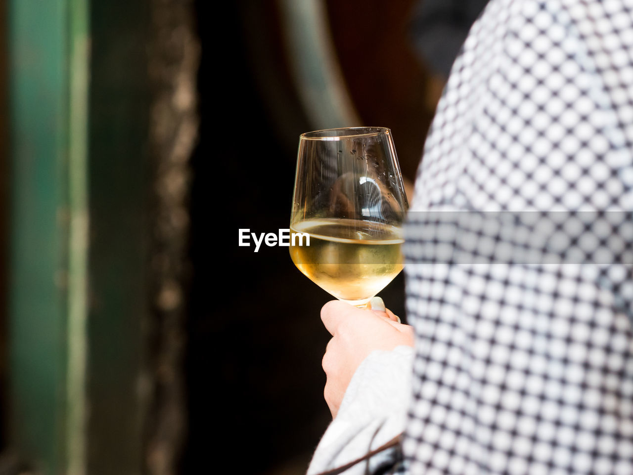 Close-up of woman holding wineglass