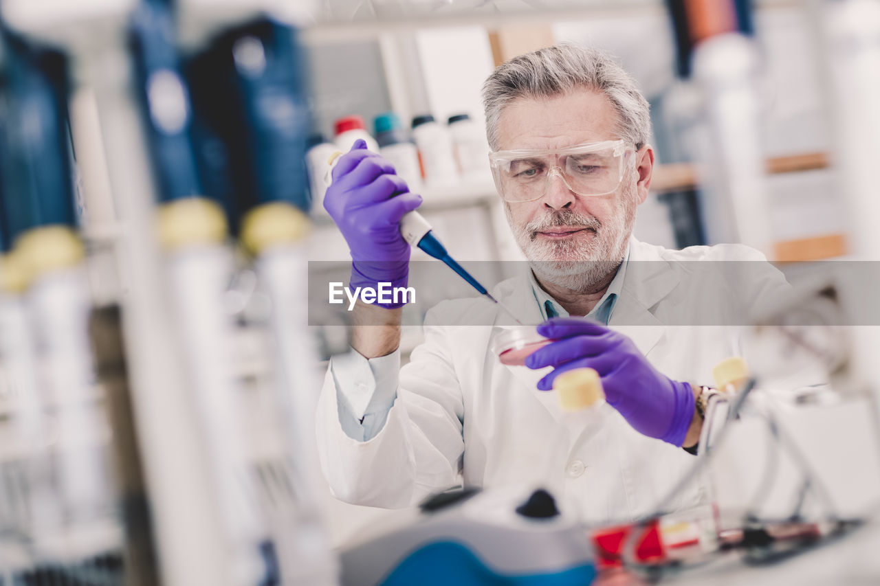 scientist holding dental equipment