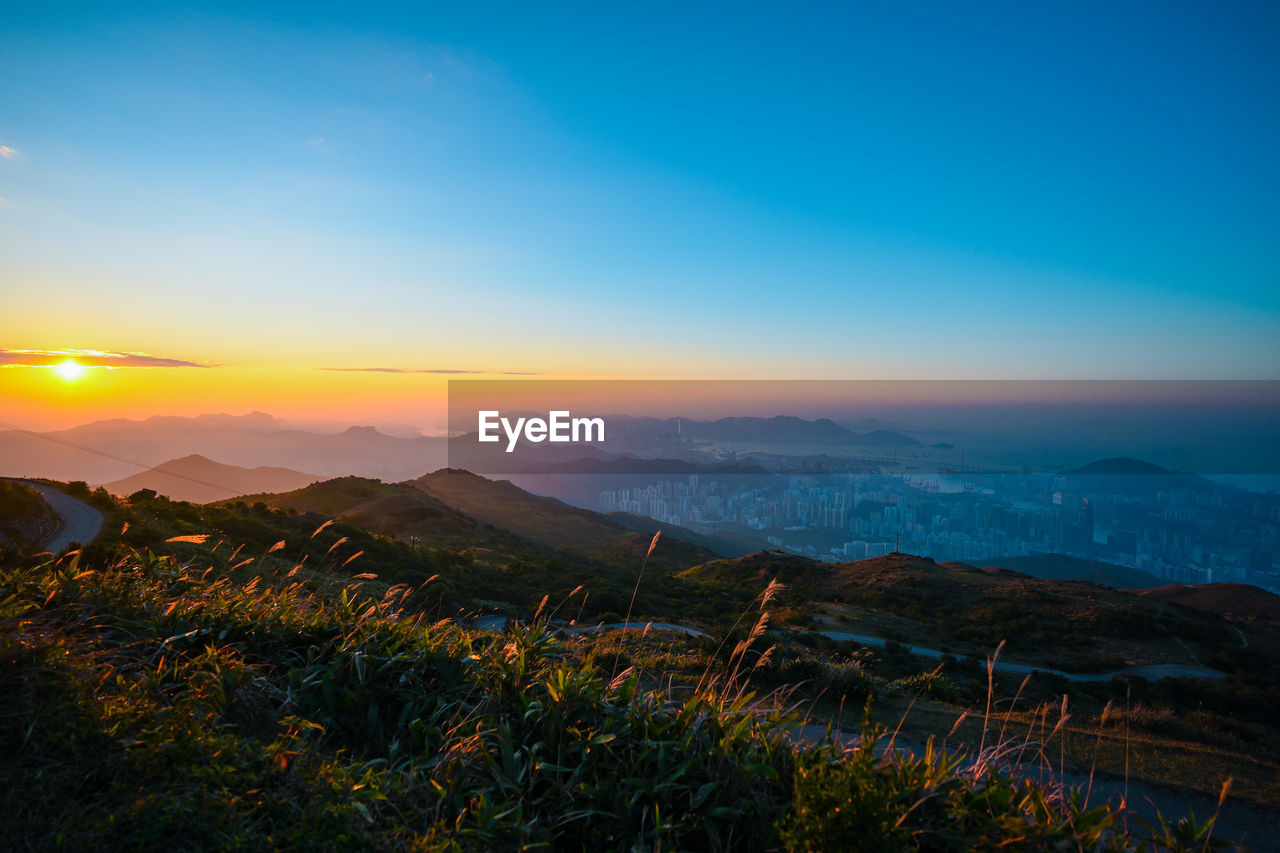 Scenic view of landscape against sky during sunset