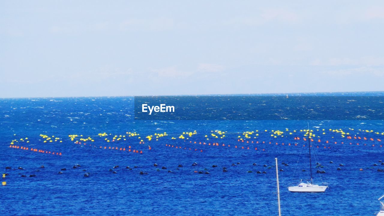 Scenic view of calm sea against clear sky