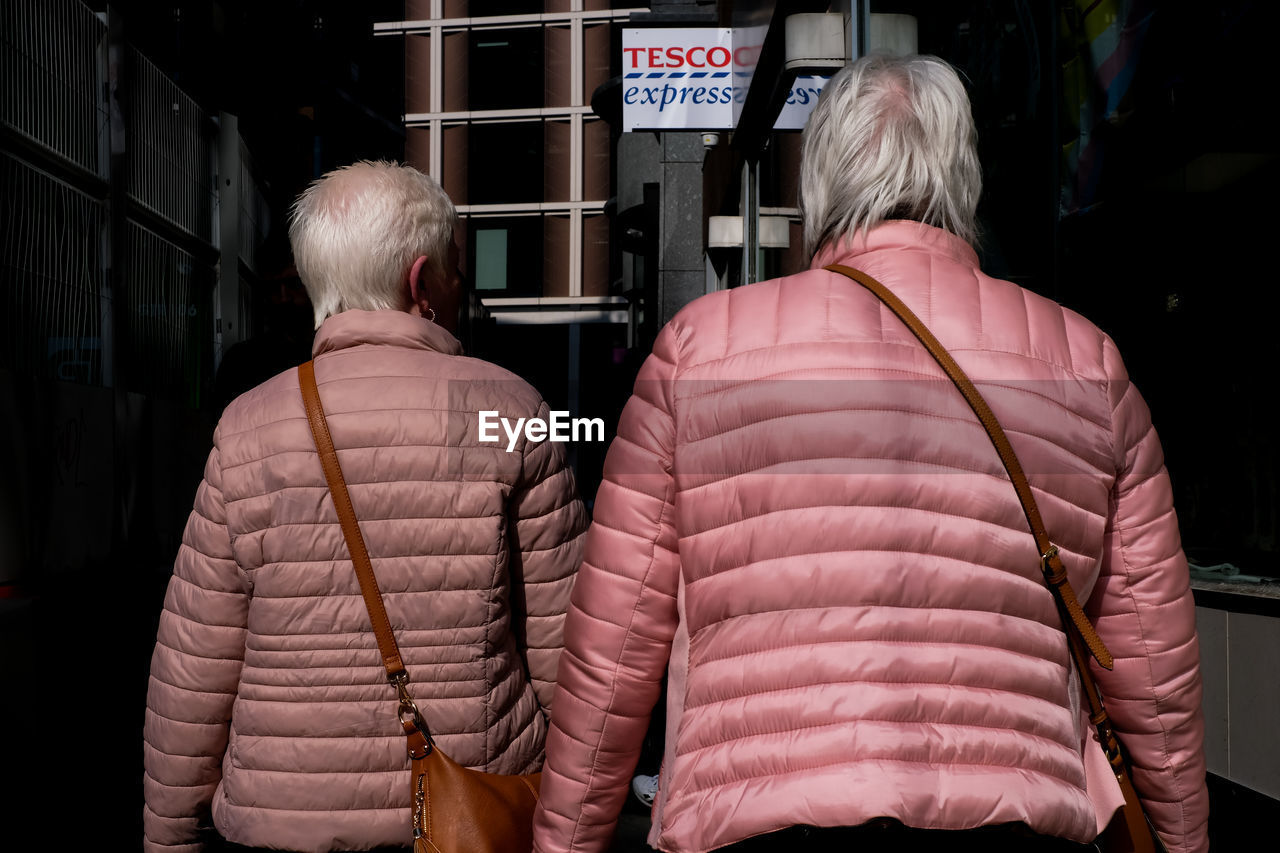 rear view, adult, senior adult, jacket, men, seniors, architecture, clothing, women, waist up, two people, lifestyles