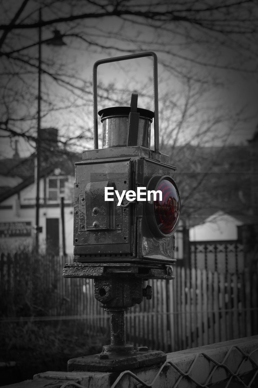 Railway signal against trees