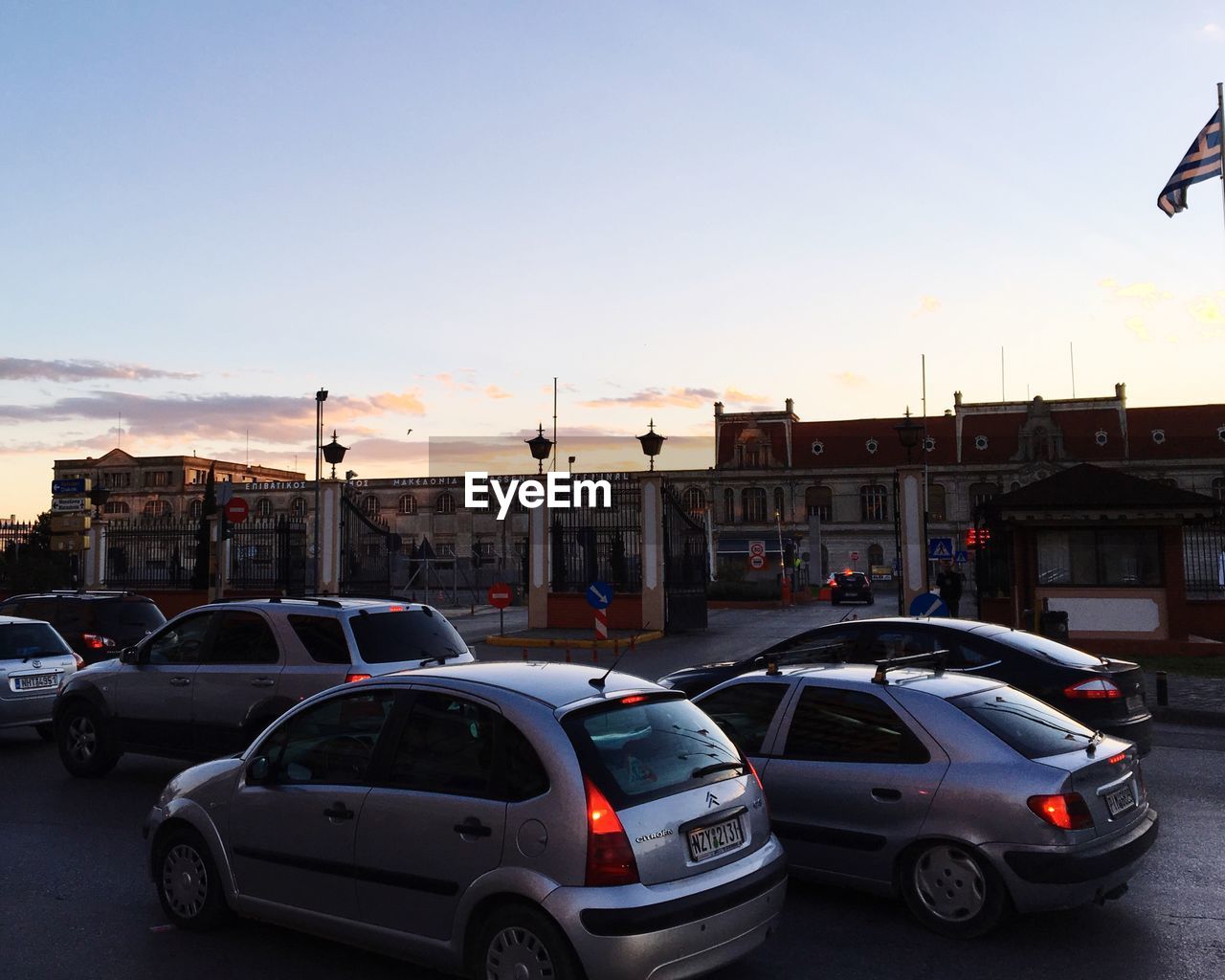 CARS PARKED IN PARKING LOT AGAINST SKY