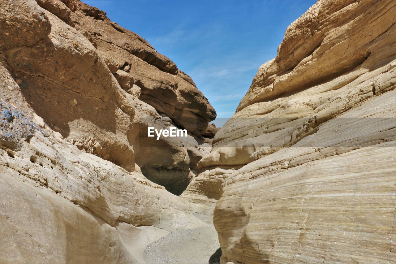 LOW ANGLE VIEW OF ROCKS AGAINST SKY