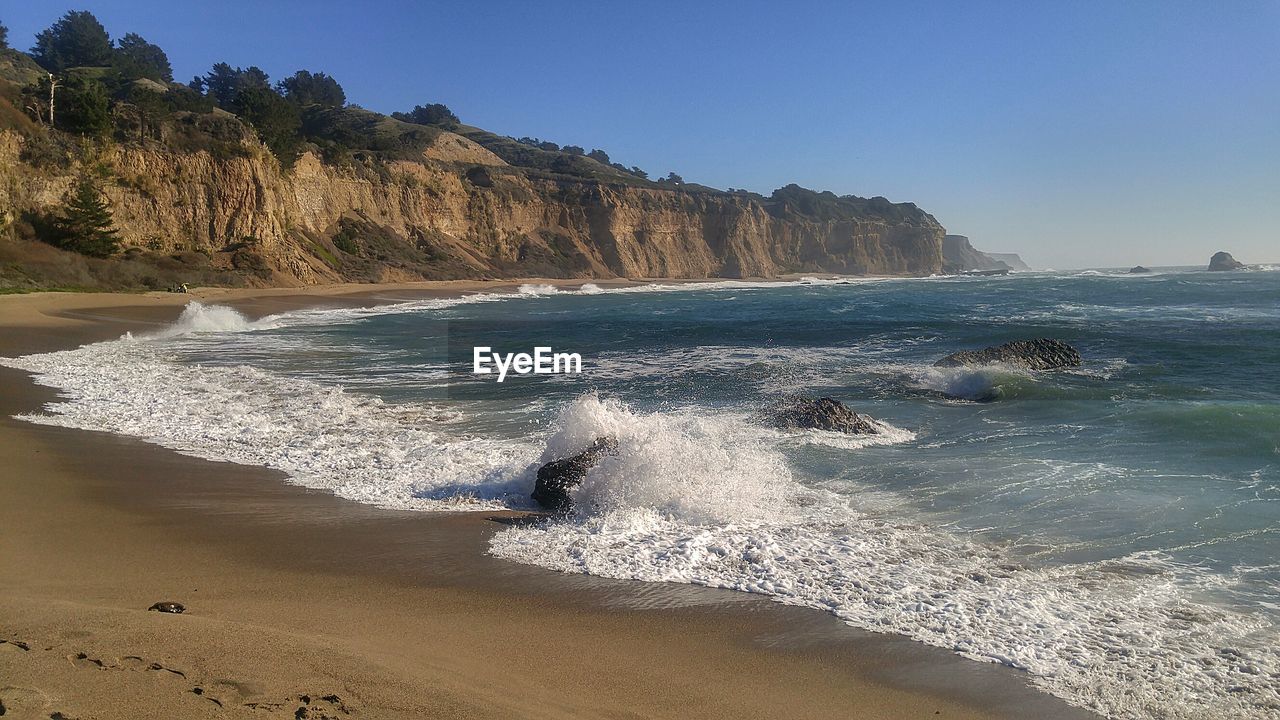 Scenic view of sea against clear sky