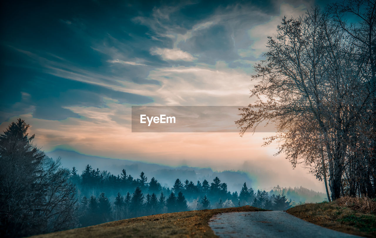 SCENIC VIEW OF ROAD AGAINST SKY DURING SUNSET