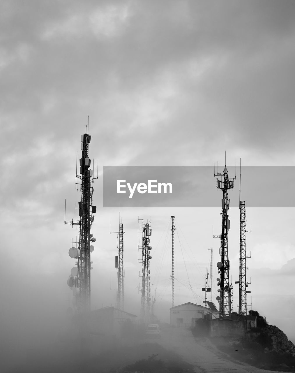 Low angle view of communications tower against sky