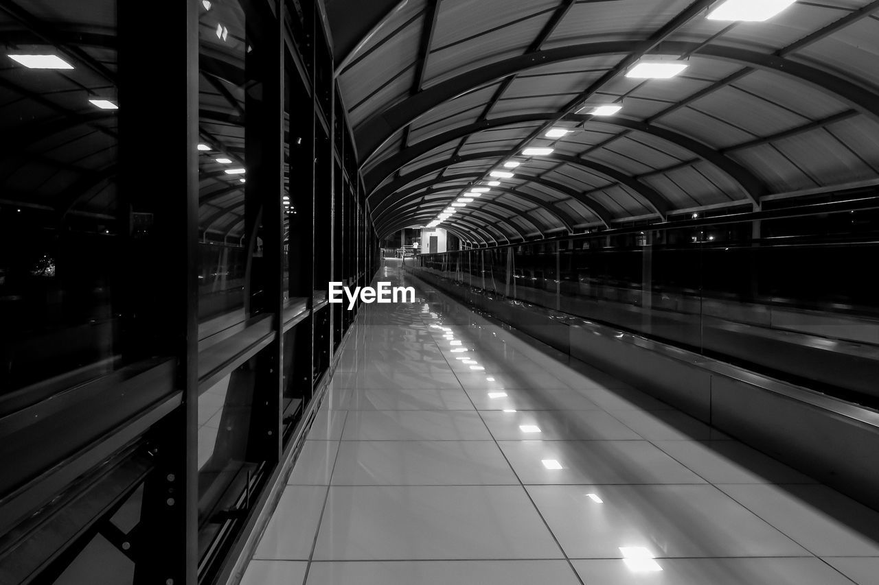 Moving walkway at subway station at night