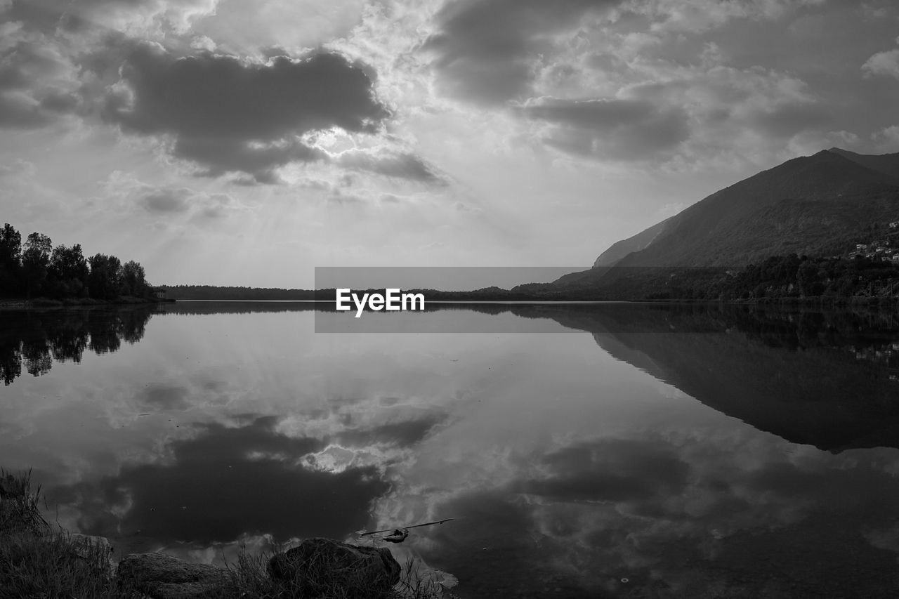 Scenic view of lake and mountains against sky