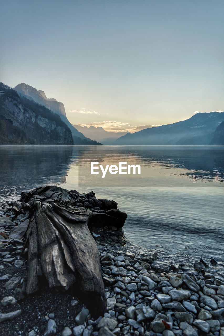 Scenic view of lake against sky during sunset