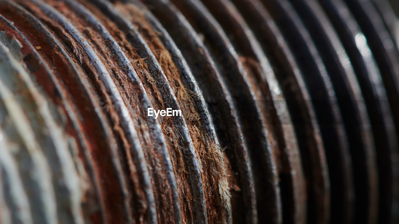 FULL FRAME SHOT OF RUSTY METAL IN CONTAINER