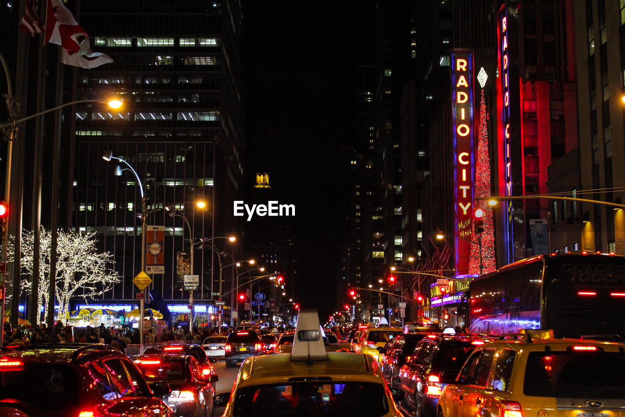 Traffic on road in city at night