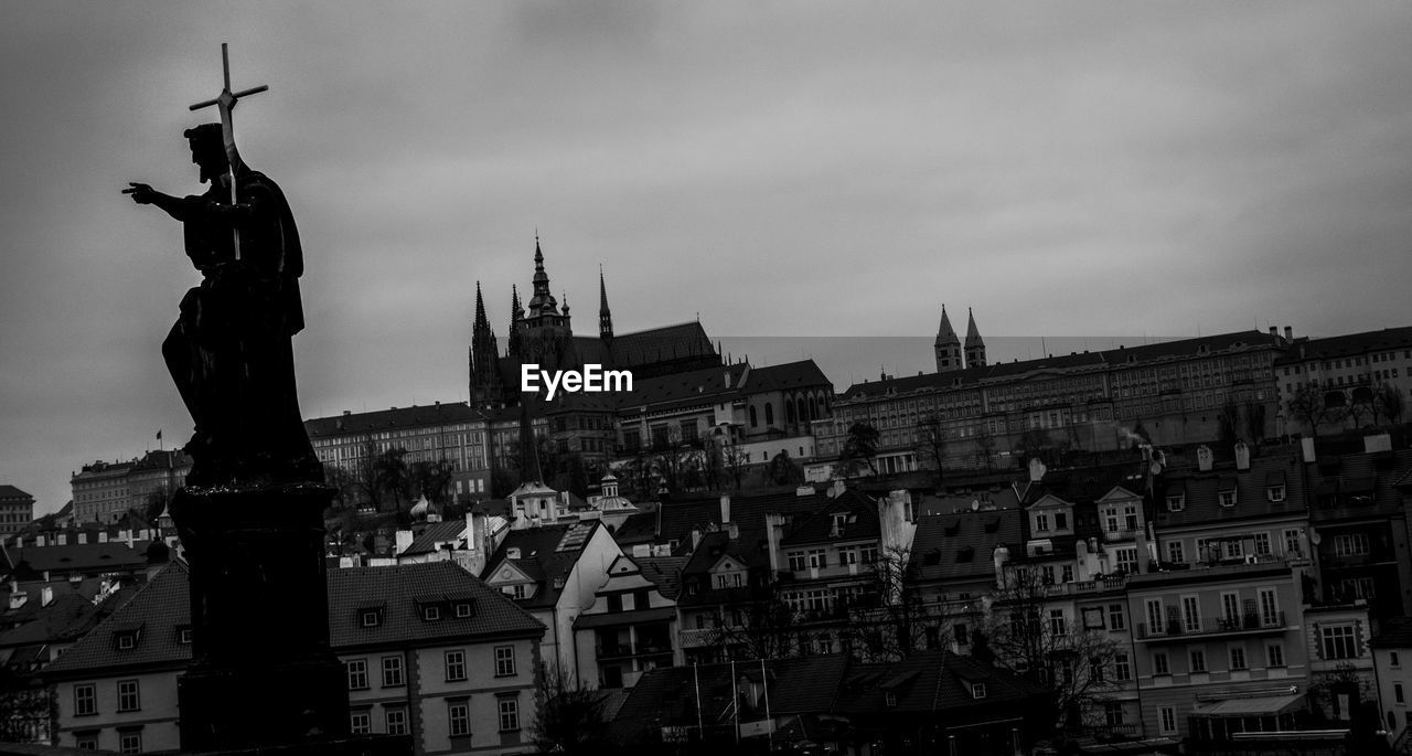 STATUE OF BUILDINGS AGAINST SKY