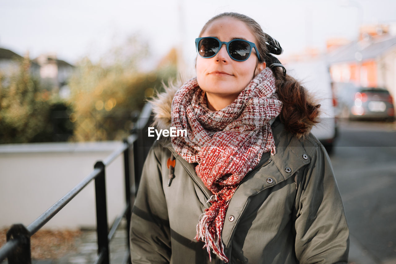 Portrait of young woman wearing sunglasses