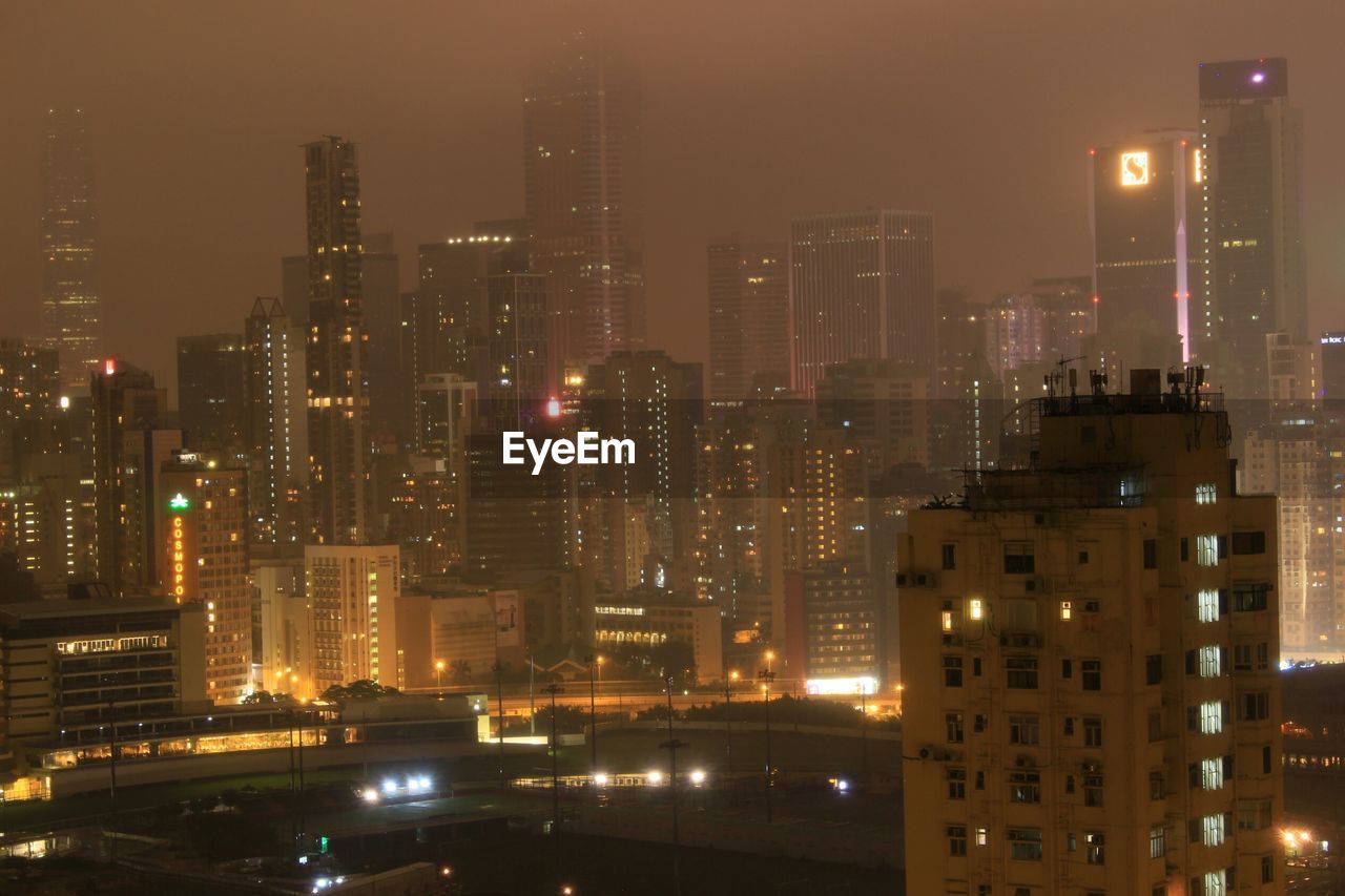 Illuminated buildings in city at night