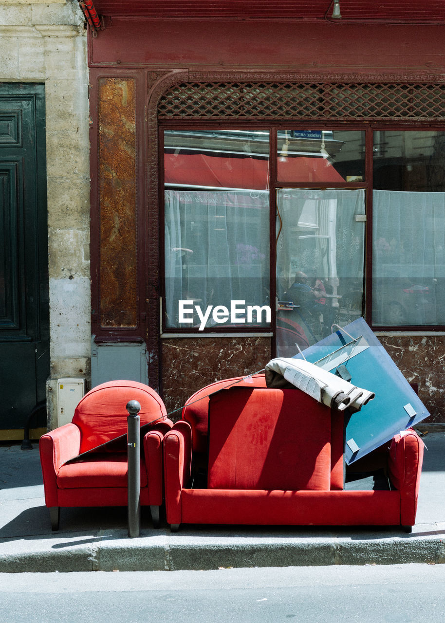 Empty chairs and tables in building