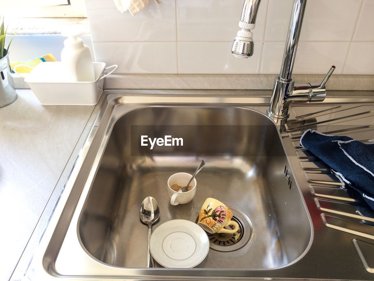 High angle view of crockery in sink at home