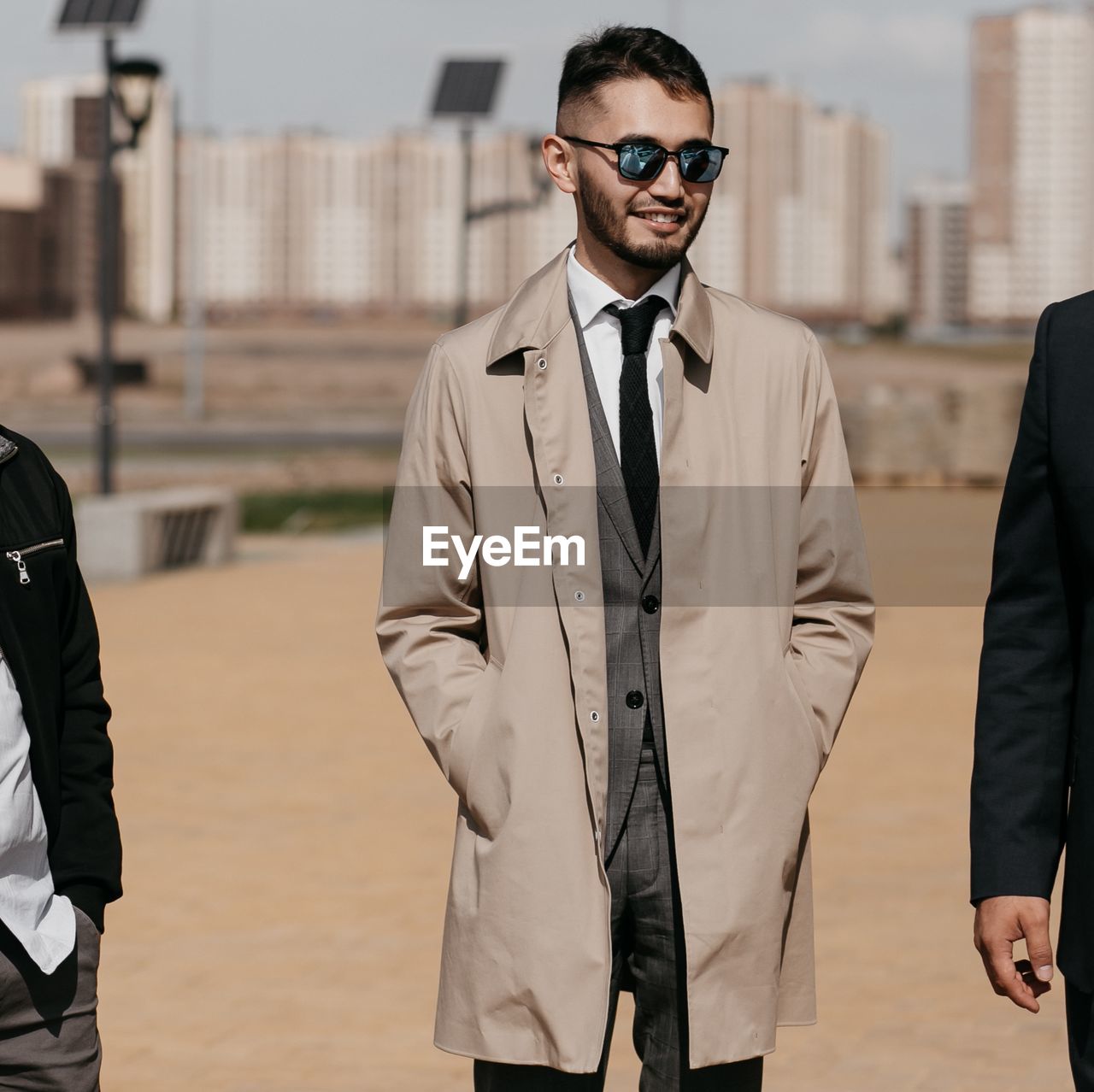 Businessman standing with colleagues
