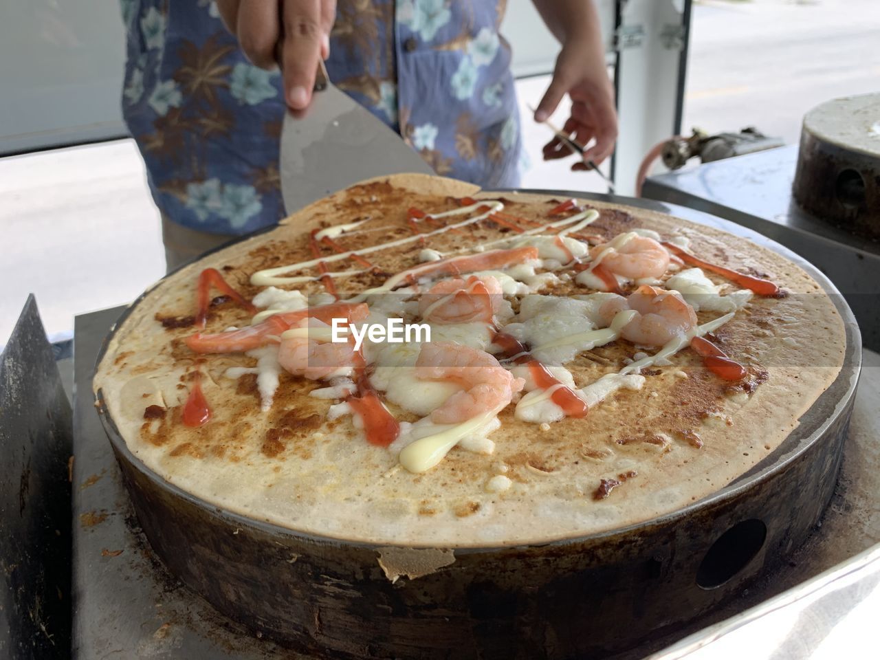 Midsection of man preparing food in kitchen